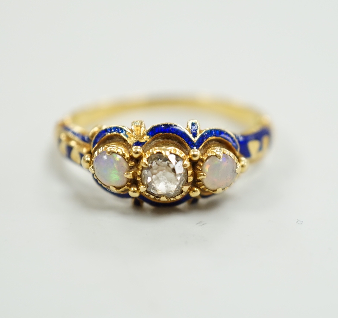 A late Victorian yellow metal, single stone diamond, two stone opal and enamelled dress ring, size K, gross weight 3 grams.